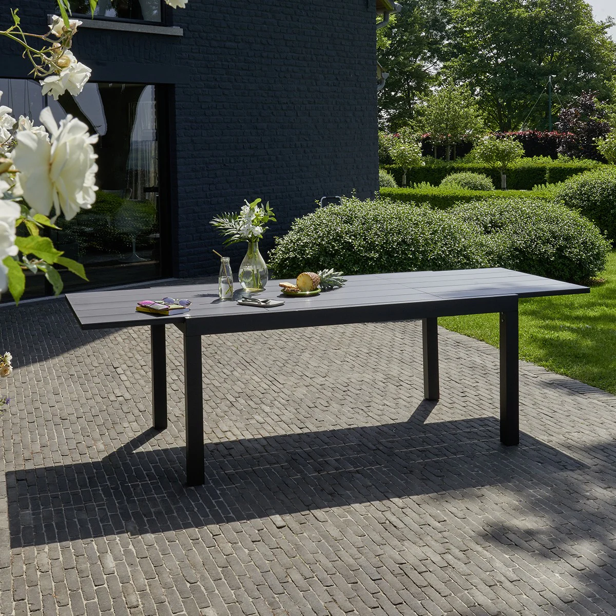 Mesa de exterior extensible de aluminio para 6/10 pers.