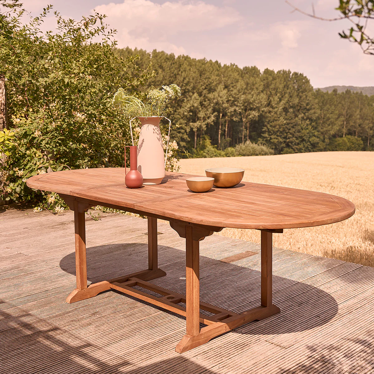 Mesa de exterior ovalada extensible de teca maciza aceitada para 8/10 pers.