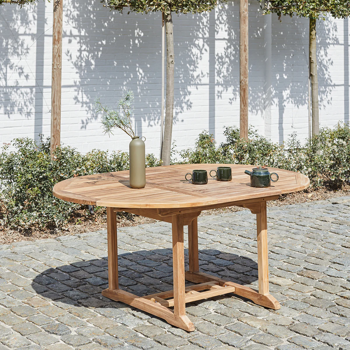 Mesa de exterior ovalada extensible de teca maciza para 6/8 pers.