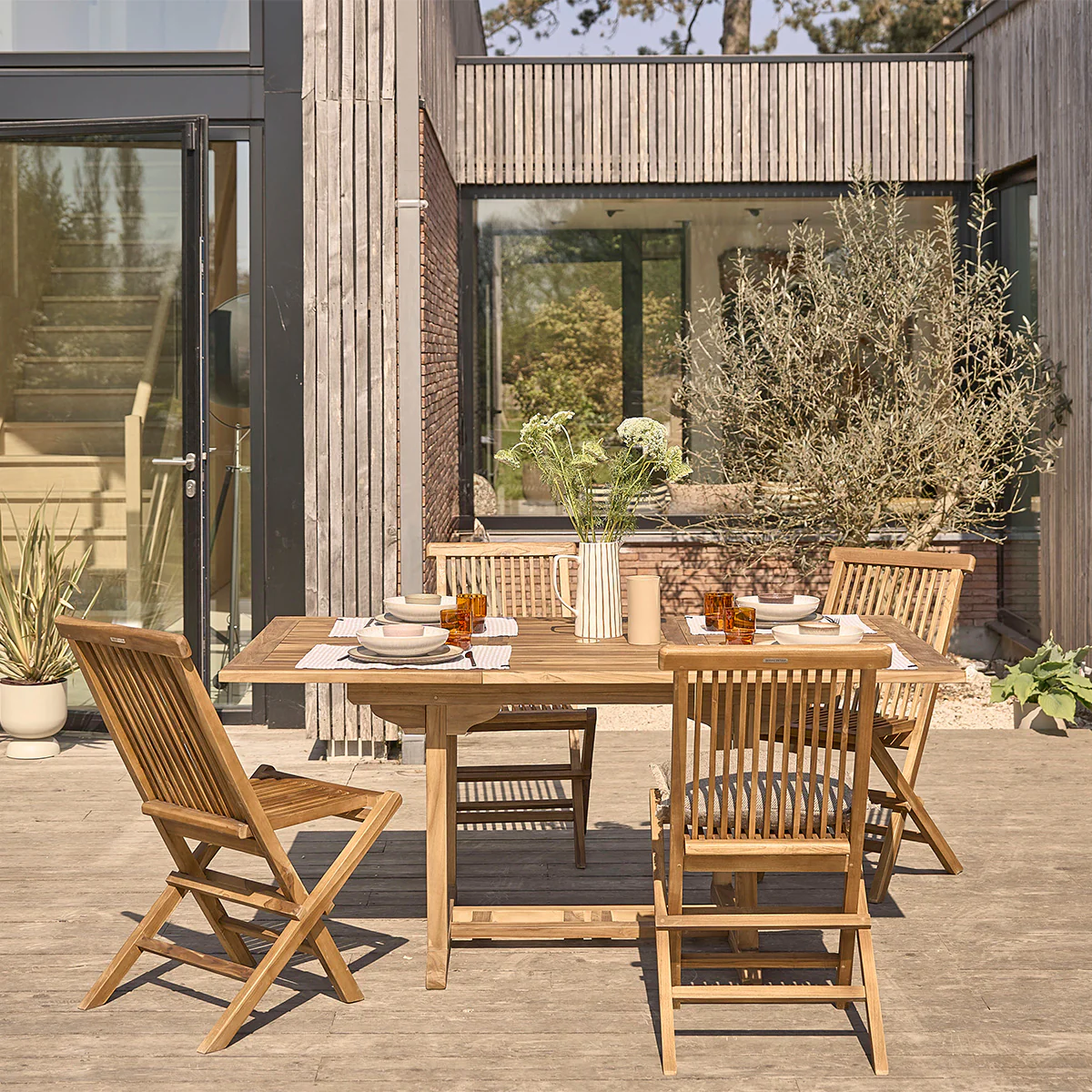 Salón de exterior extensible de teca maciza aceitada para 4/8 pers.